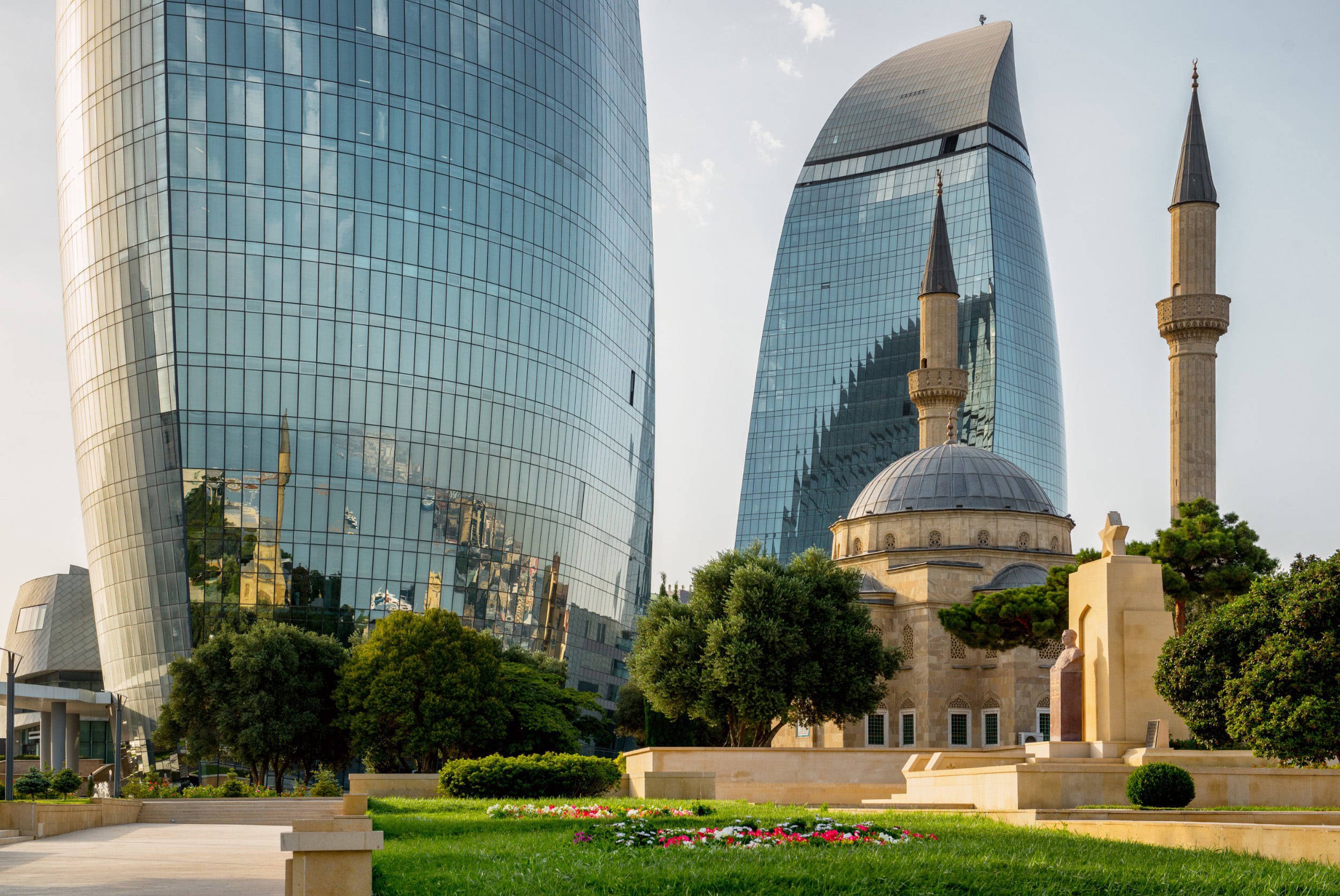 Skyscrapers in the background and a mosque in front of the city of Baku in Azerbaijan