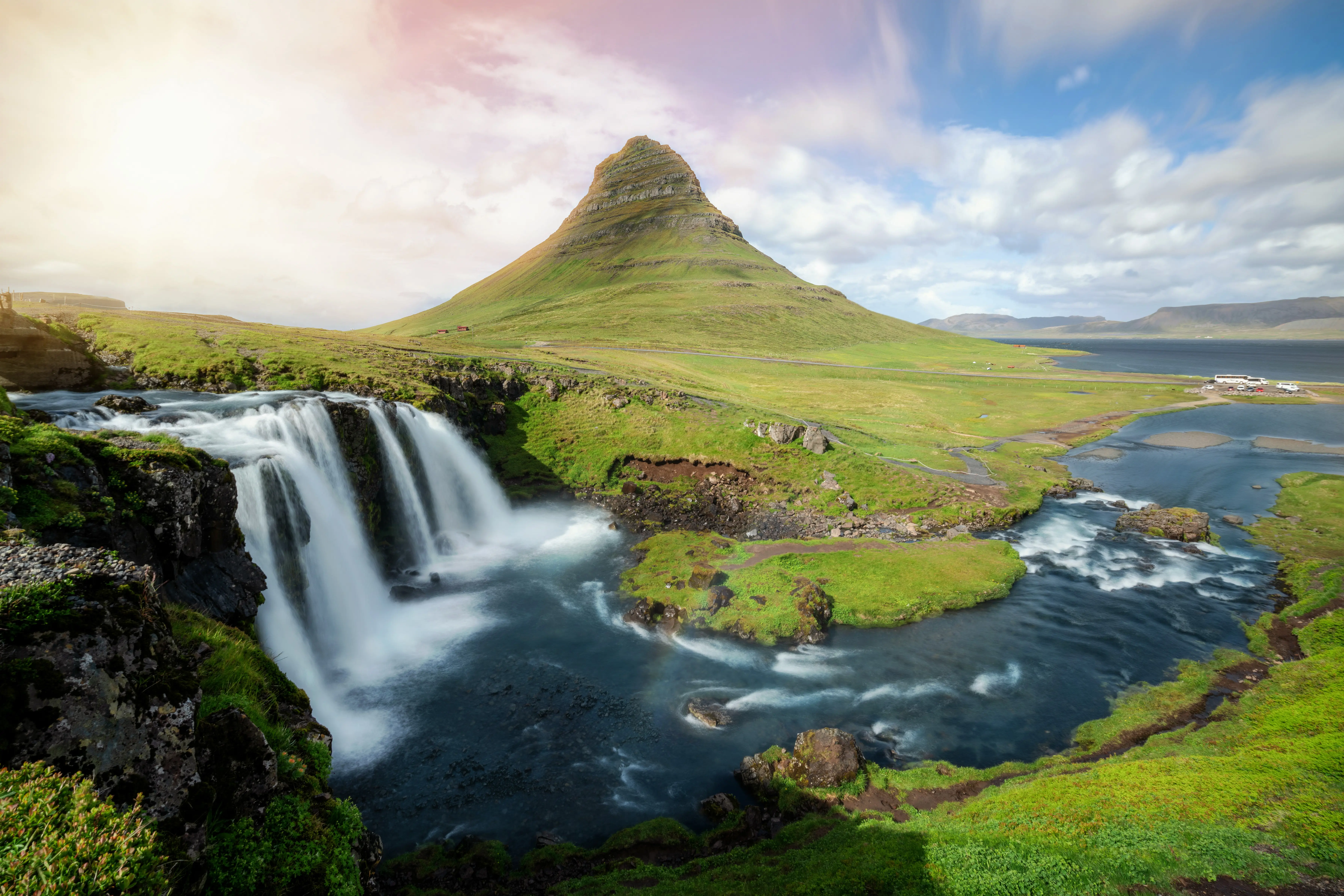 mountains with greenery in the wilderness with waterfalls and sunset