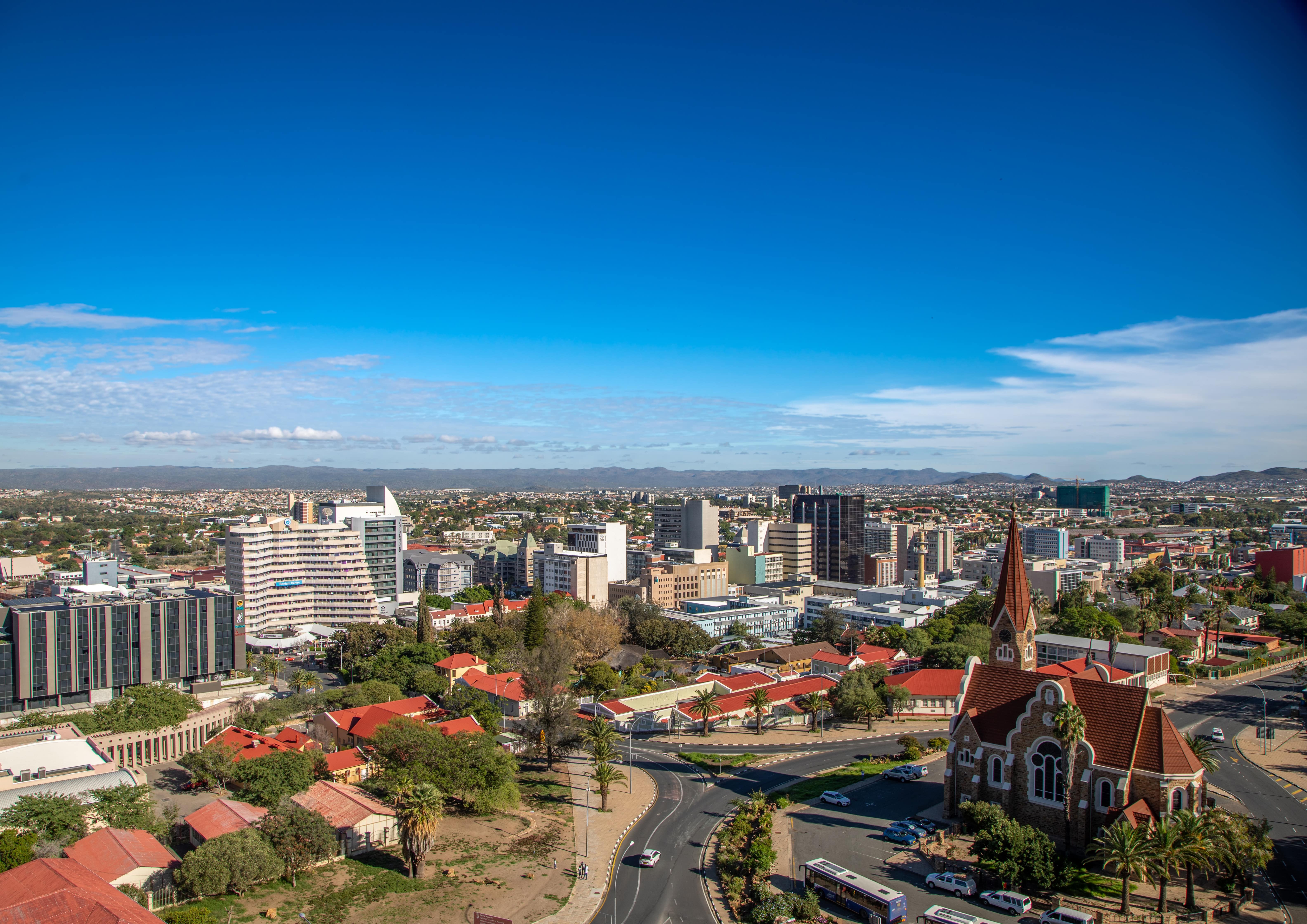 Travel to Windhoek - Panoramic view of the city of Windhoek in Namibia with buildings and greenery