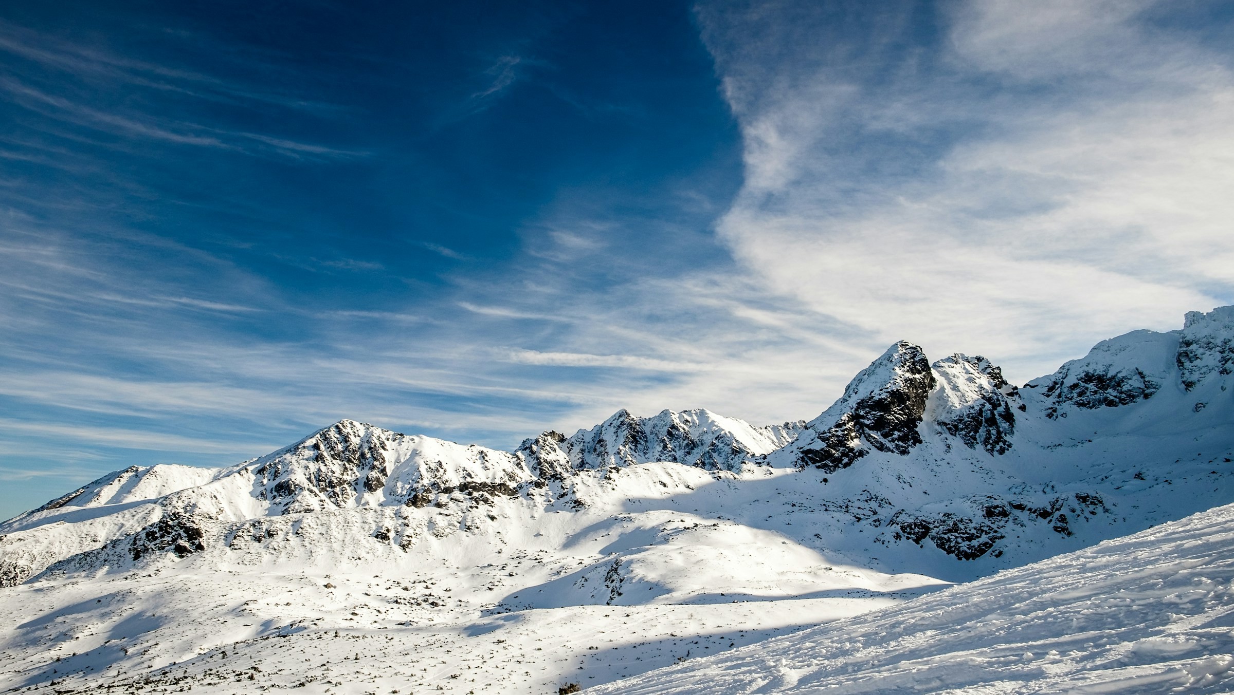 Snow-covered countryside with clear blue sky in Zakopane, Poland